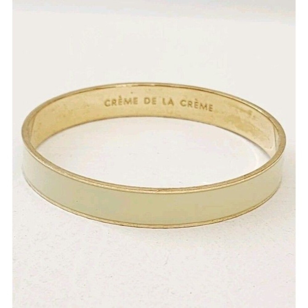 Kate Spade Gold Plated Cream Enamel Creme de la Creme Idiom Bangle Bracelet 7.5"